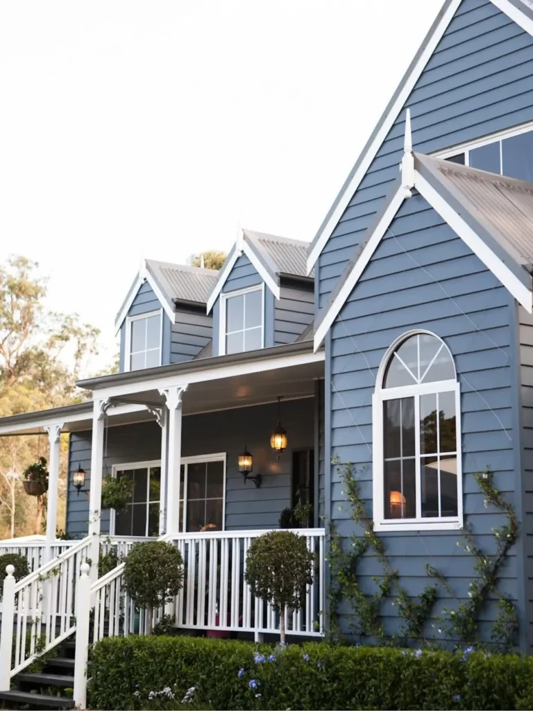Dark Blue Cottage Exterior With Charming Front Porch