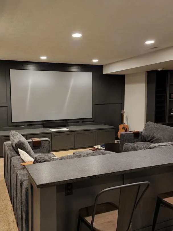 Dark Graphite Basement with Home Theater Design