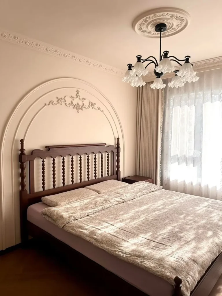 Decorative Arch Wall Molding Behind Wooden Headboard