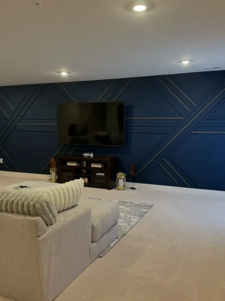 Deep Navy Basement with a Geometric Accent Wall