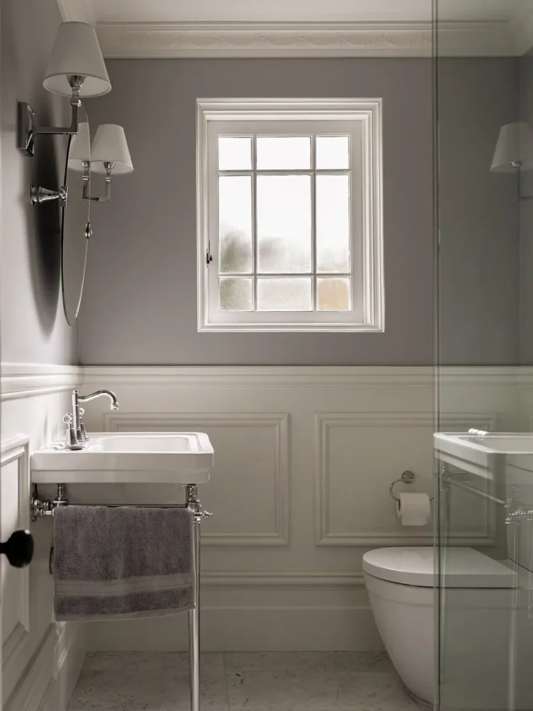 Grey Picture Frame Wainscoting for a Bright Bathroom