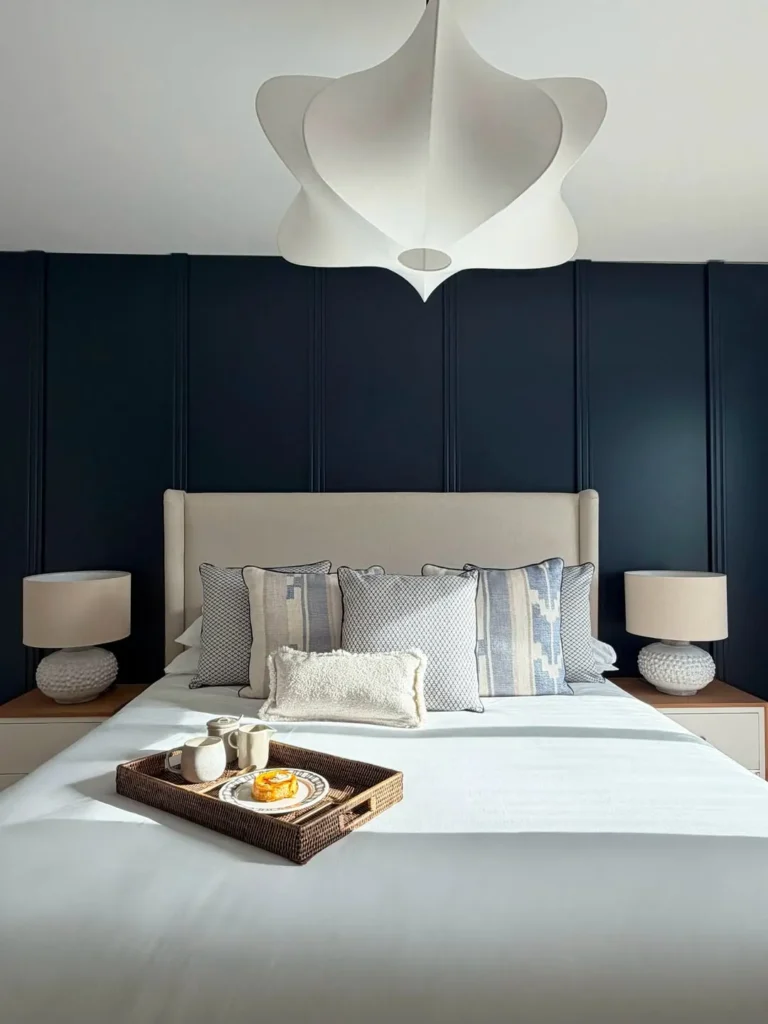 Navy Vertical Panel Wainscoting Behind Upholstered Bed