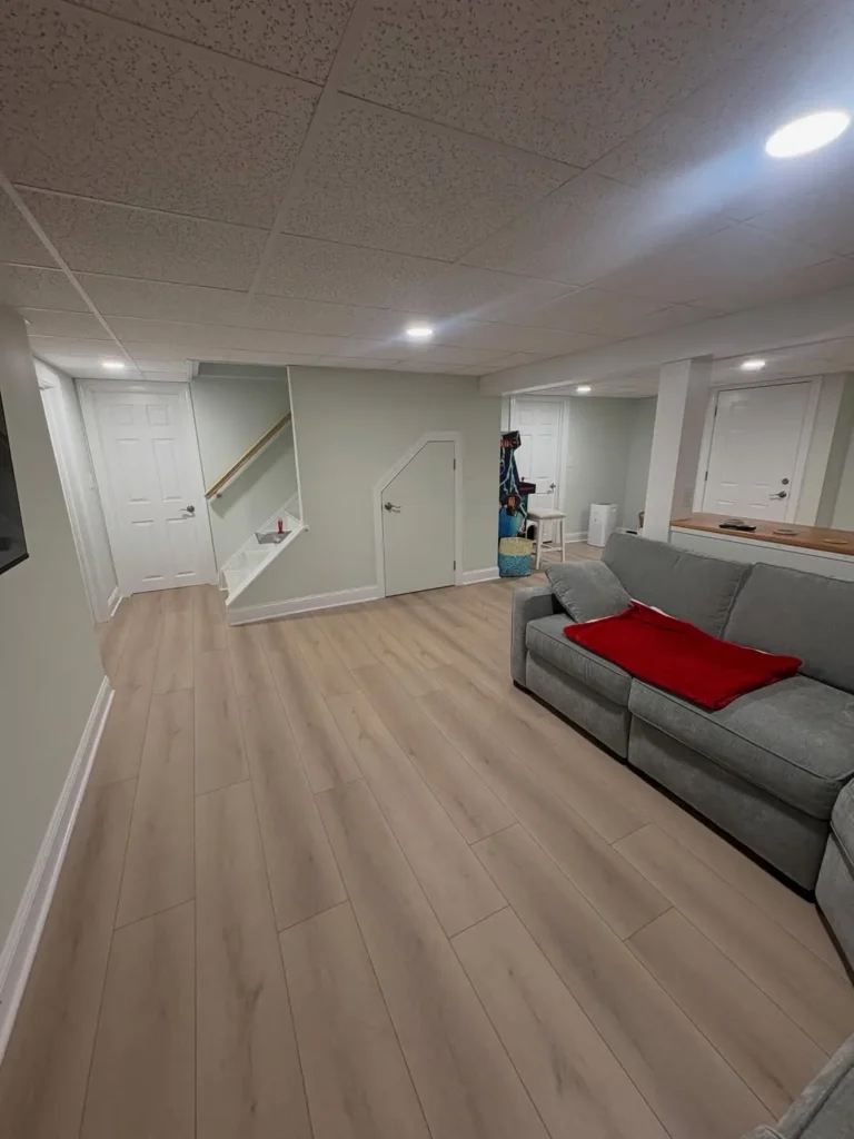 Soft Sage Green Basement with Bright Airy Appeal