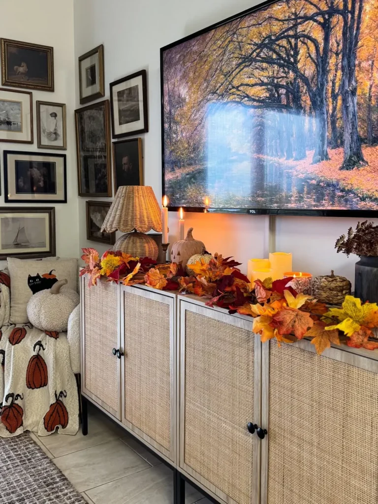 TV Stand Styled With Fall Leaves and Candles