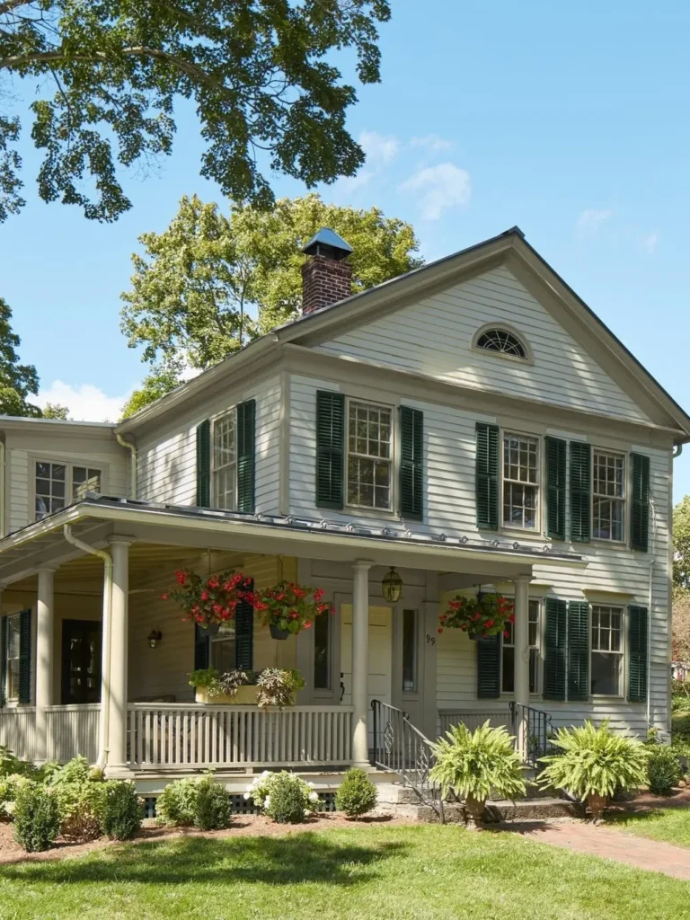 Traditional White Exterior with Dark Green Shutters