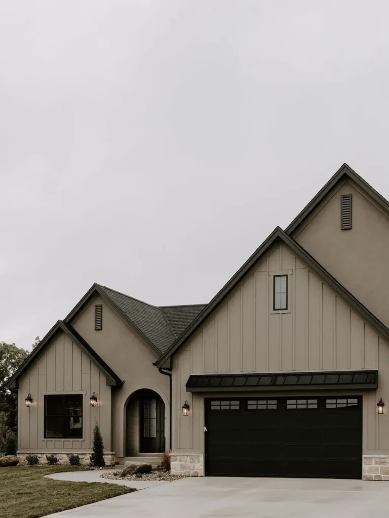 Warm Greige Exterior with Black Garage Door Contrast