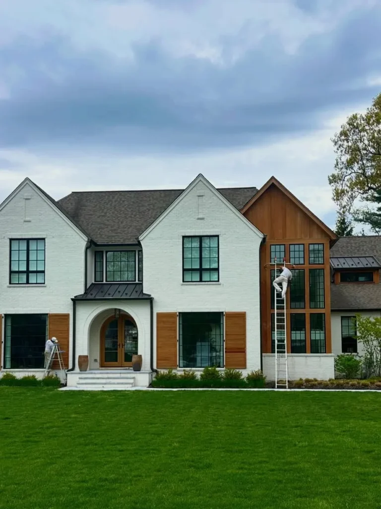 White Brick Exterior with Natural Wood Accent Panels