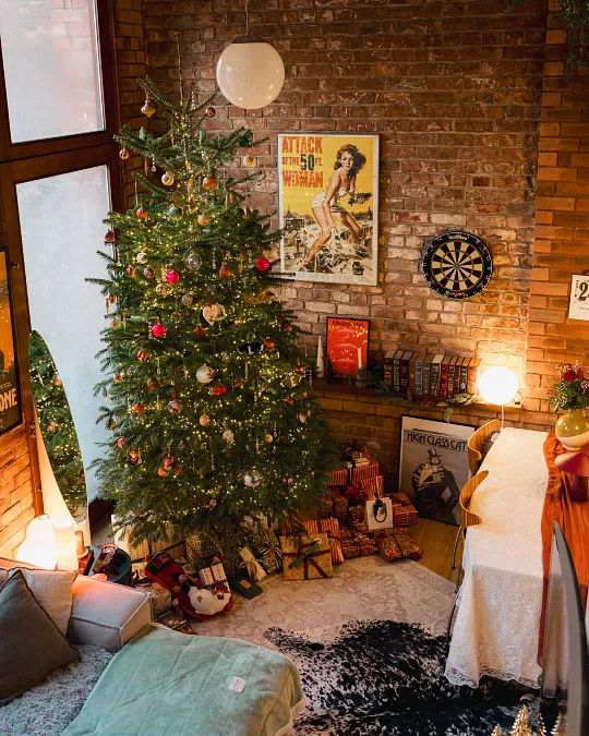 Warm-Lit Tree Against an Exposed Brick Wall