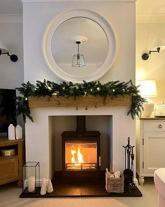 Evergreen Mantel with Warm Firelight