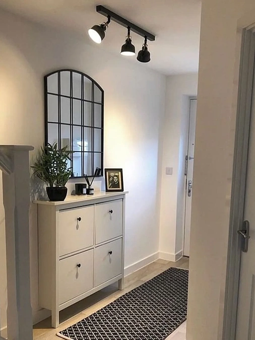 Black-Framed Mirror Entryway Storage